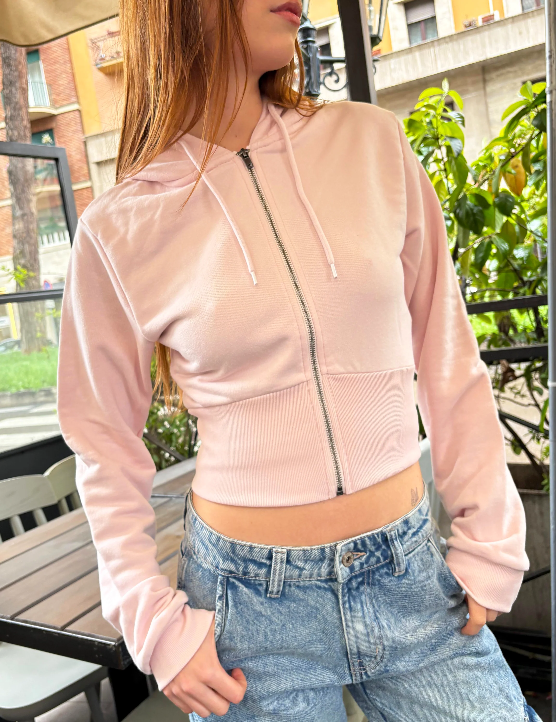 Felpa crop rosa effetto corsetto
